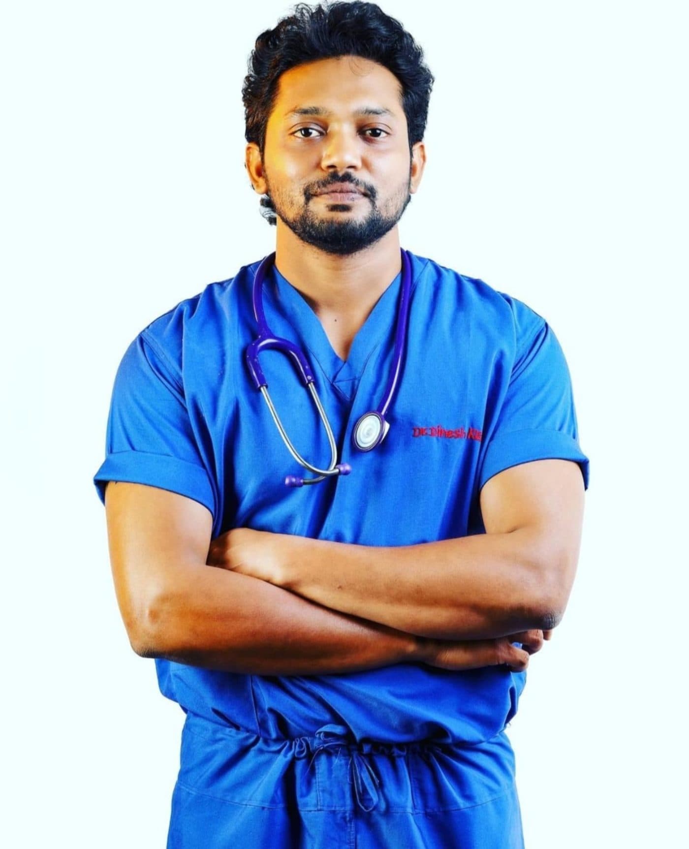 Dr. Dinesh Kumar with a stethoscope, studio portrait